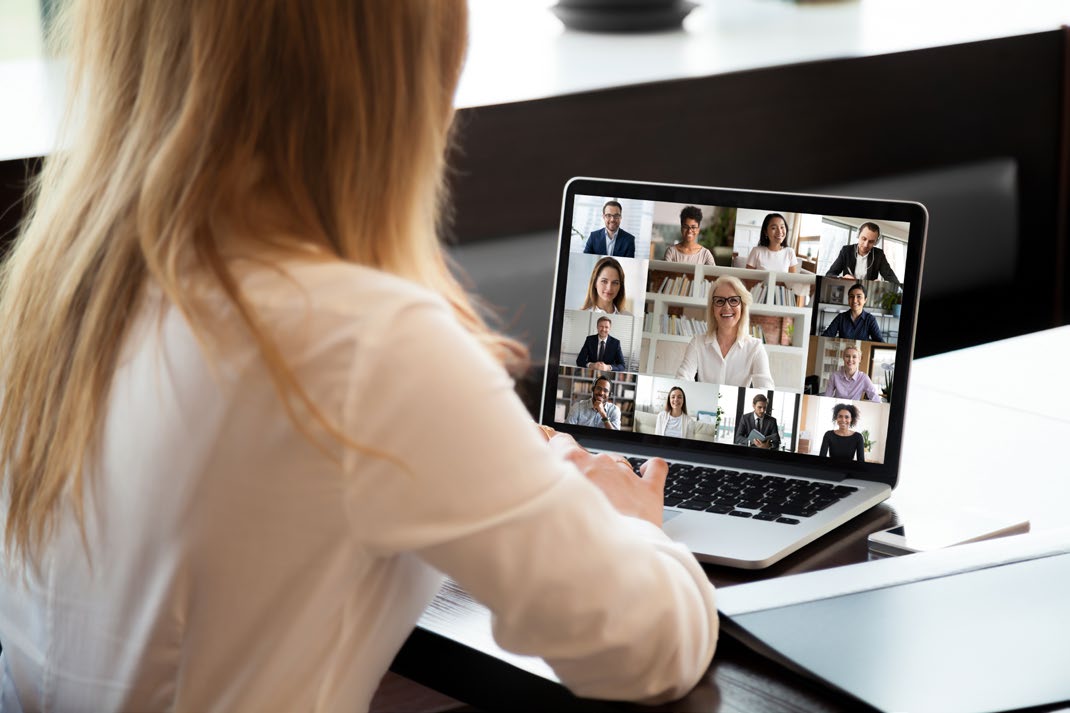 Someone doing a virtual webinar on a laptop