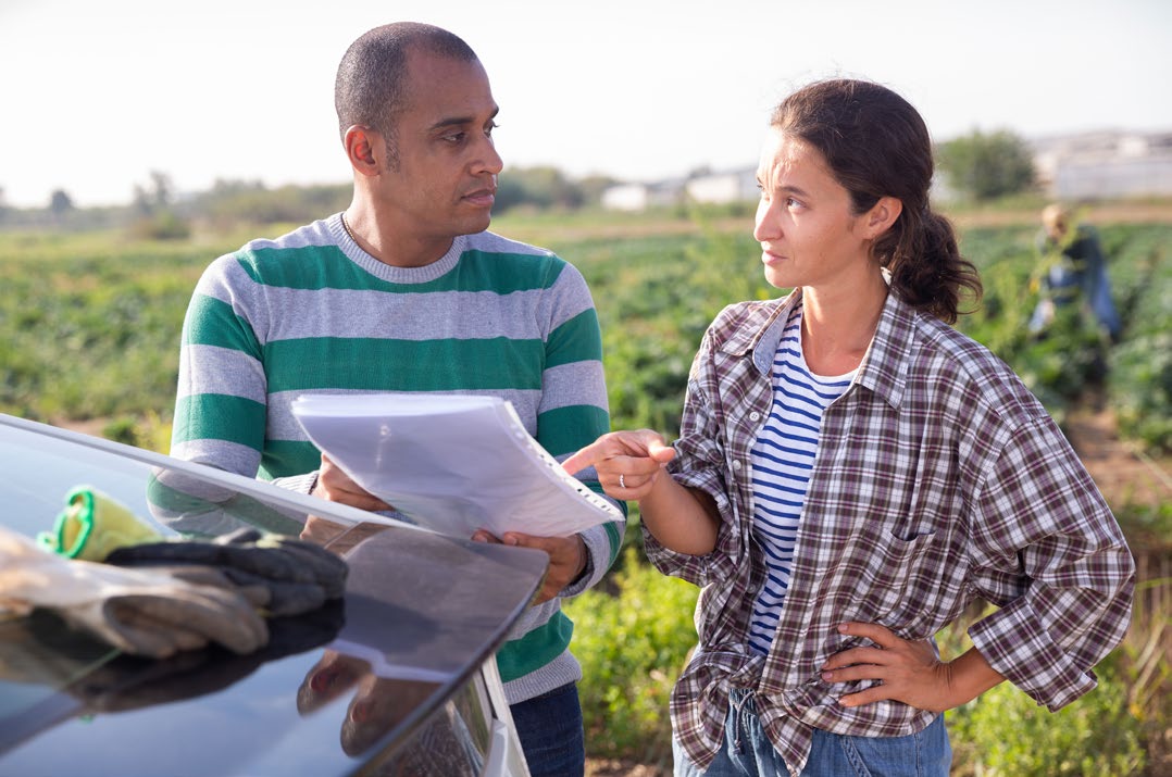 Farm manager going over a document