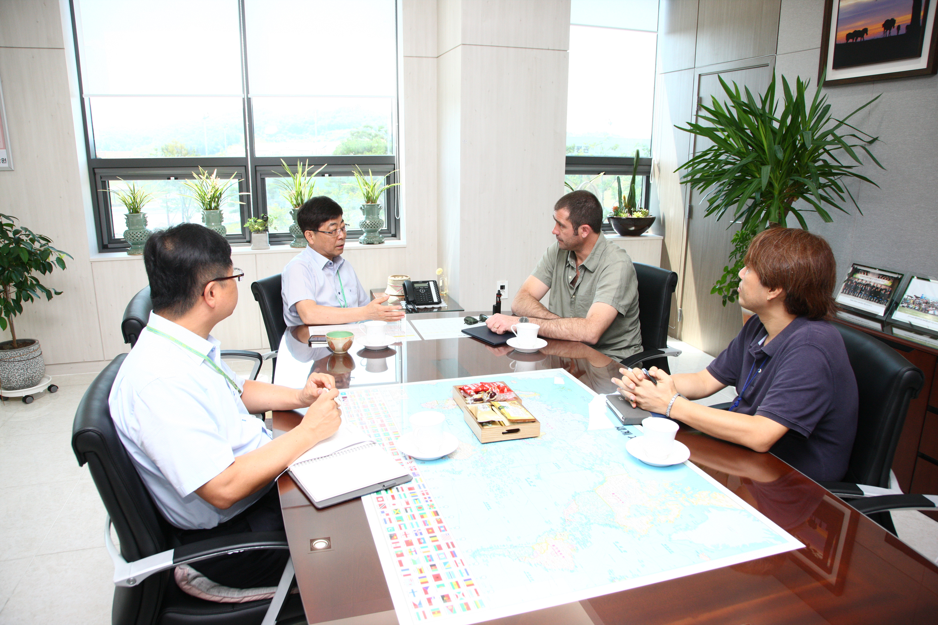 Four men in a business meeting