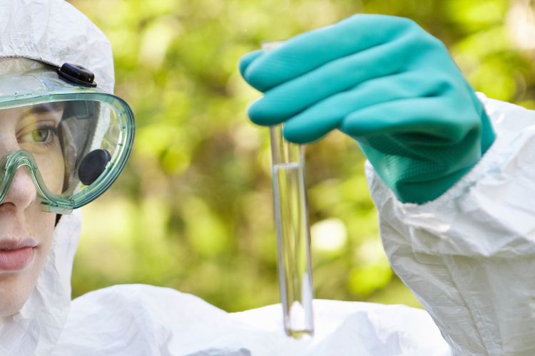 Woman looking at water sample