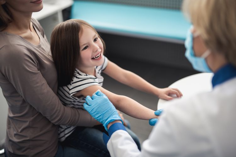 Smiling child at a doctor's appointment.