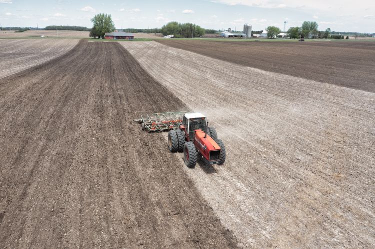 Red tractor in field