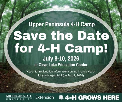 A sign with U.P. 4-H Camp dates and location