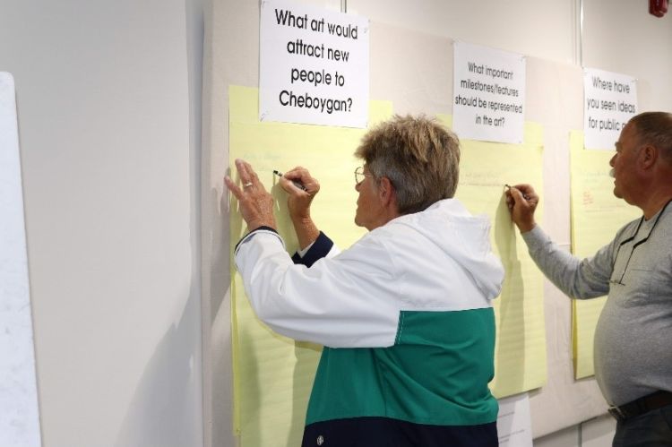 Community members provide feedback during a public art charrette in Cheboygan. | Photos by Lindsey Gardner