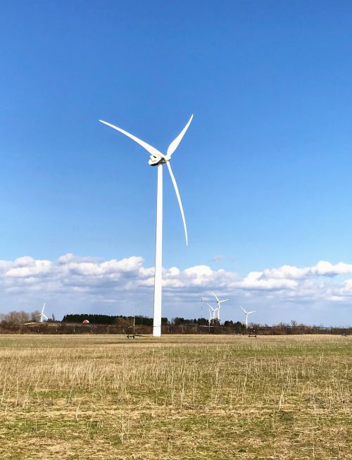 A wind turbine in a field.