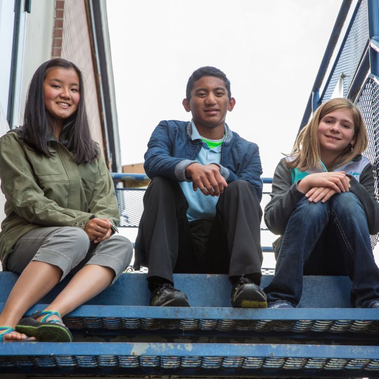 Three smiling youth.