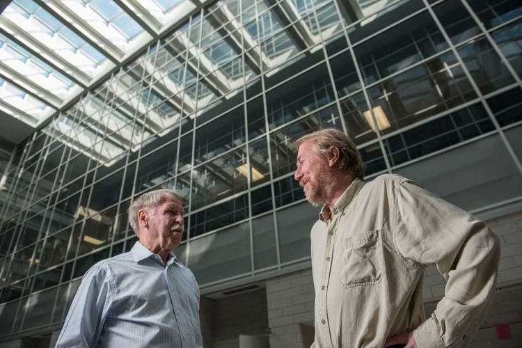 Erik Goodman (L) and Richard Lenski (R). Photo by Kurt Stepnitz.