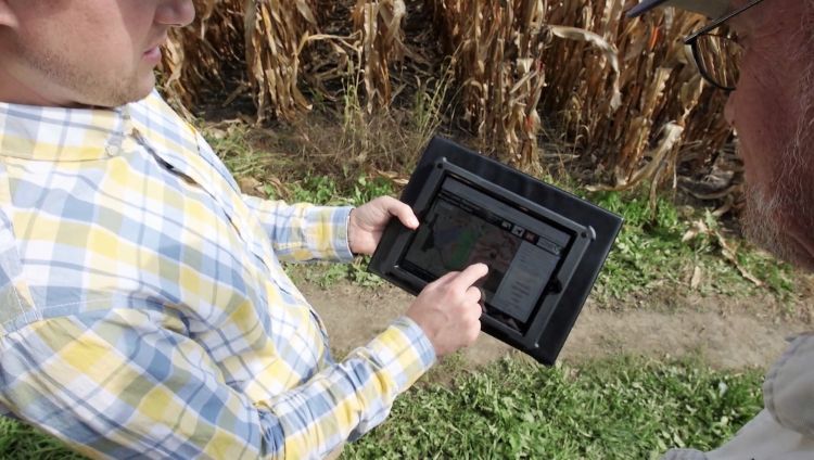 Ben Wickerham of The Nature Conservancy uses the MSU Great Lakes Watershed Management System to inform decision making with partner farms.