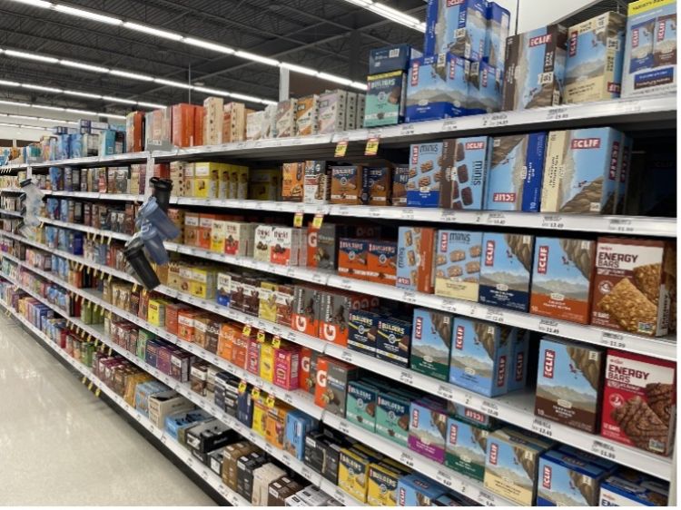 A photo of processed food on the shelves of a supermarket.