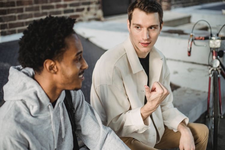 Two young men talking.