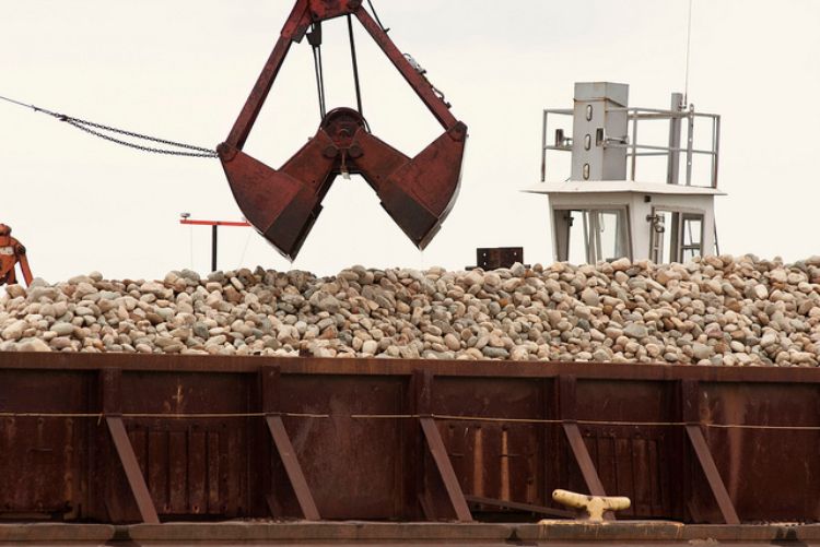 The rock was placed with a crane, scoop by scoop, to ensure accurate placement. Photo: Michigan Sea Grant