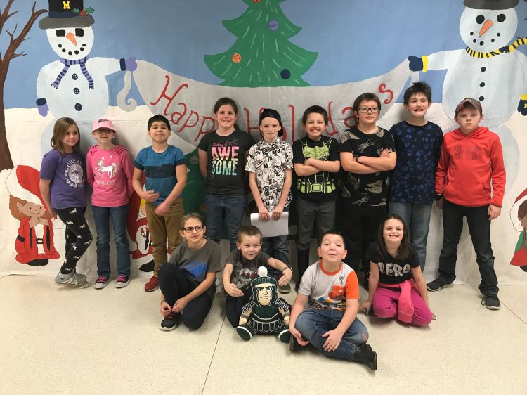 Children smile with Sparty.