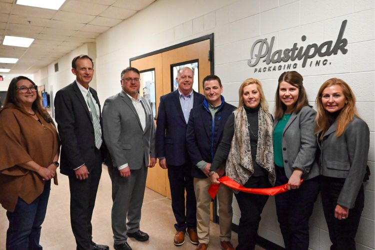 Image of leaders from CANR, the School of Packaging, Plastipak and the Young Family Foundation outside of the newly renamed Plastipak Processing Lab in the MSU School of Packaging Building.