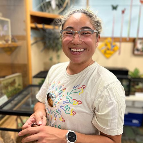 Taylor Hori with a bug friend in the MSU Bug House.