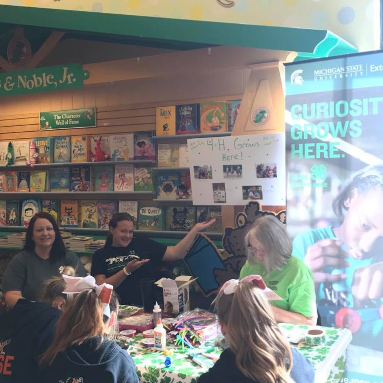 Volunteers sitting around a table.