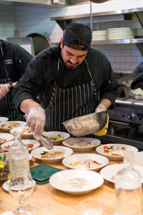 Chef plating food.