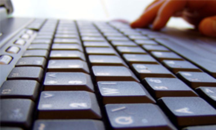 Keyboard with hands typing.