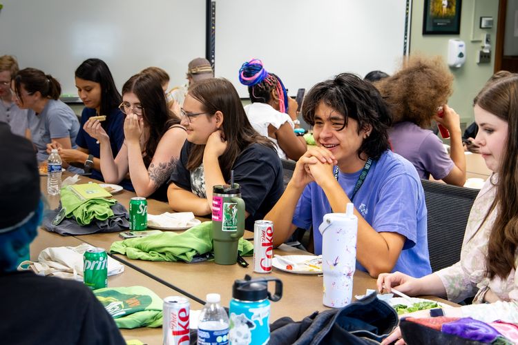 new students eating lunch together at a table