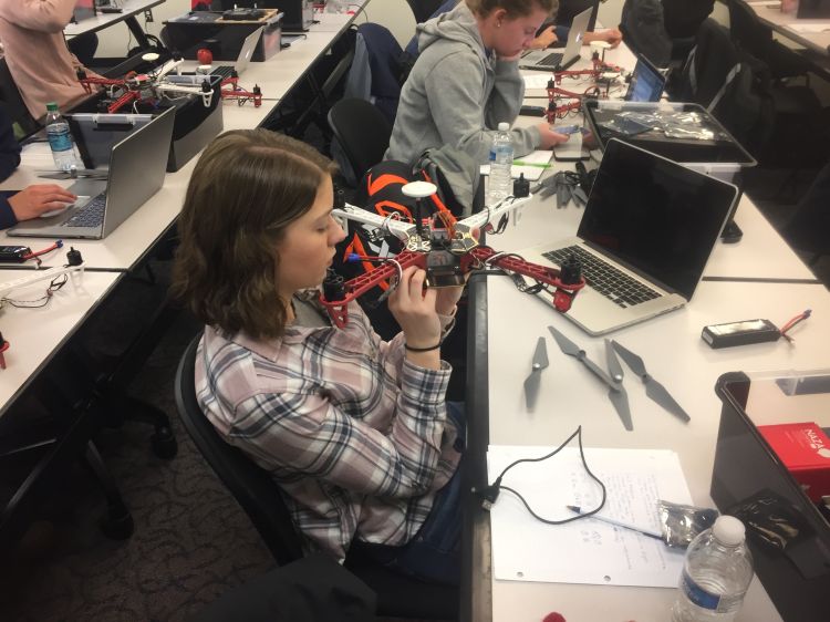 IAT student with a drone.