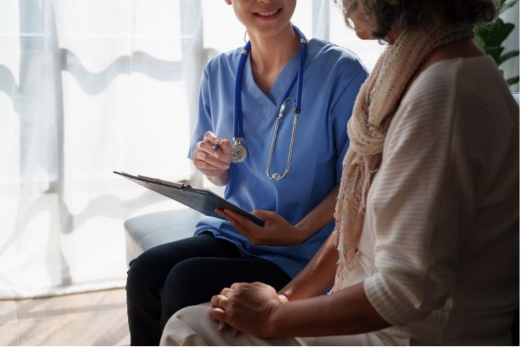 Older woman speaking with her doctor.