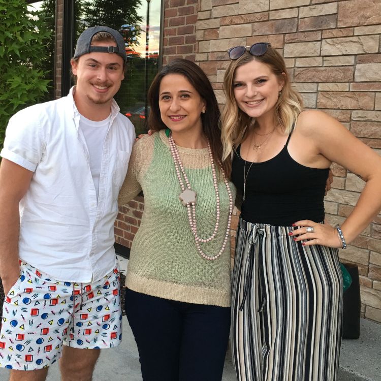 Photo of interior design seniors with their Clinton Scholarship study abroad advisor. Assistant Professor Linda Nubani is standing in between Michael Bry and Lauren Stoklas.