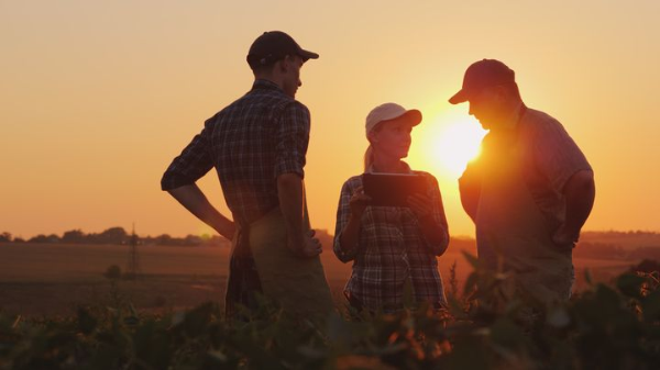 group of farmers talking outside