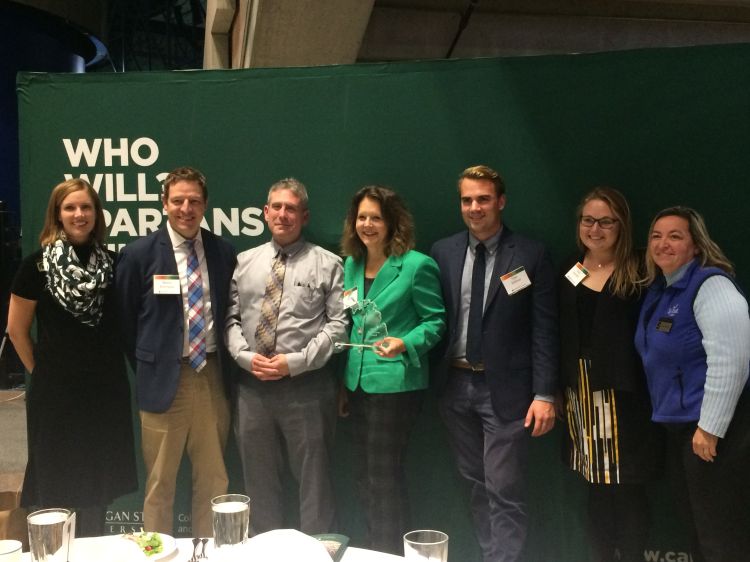 SEMCOG received a Key Partner award from MSU Extension. From left, Heather Triezenberg (Sea Grant), SEMCOG's Kevin Vettraino, Bill Parkus, Amy Mangus, Tyler Klifman, Devan Rostorfer, and Extension educator Mary Bohling. Photo: Cindy Hudson | Sea Grant