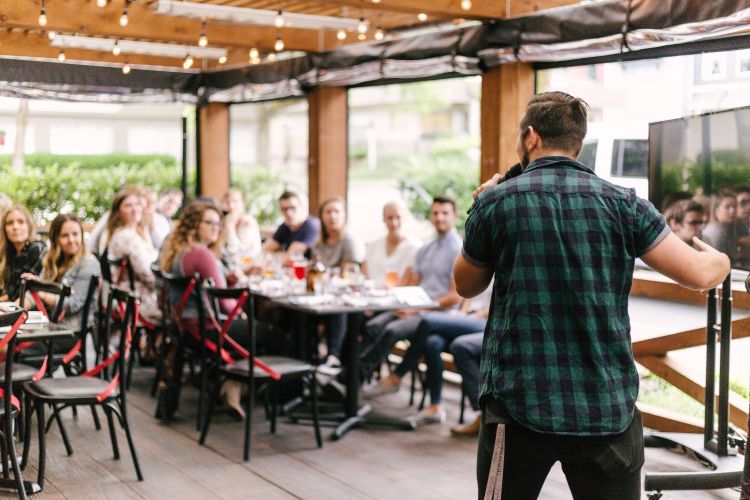 Man giving a presentation to people in a room