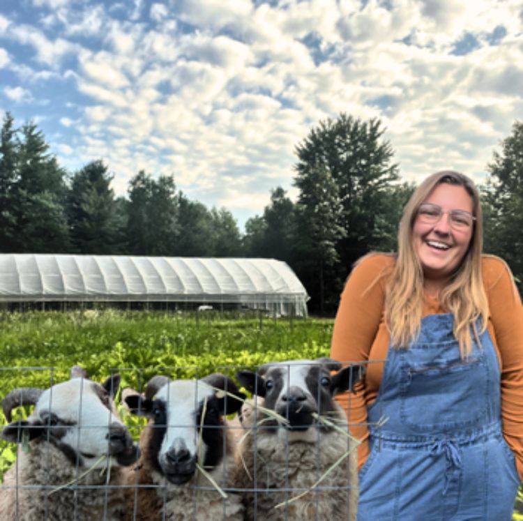 People standing in front of a vegetable crop