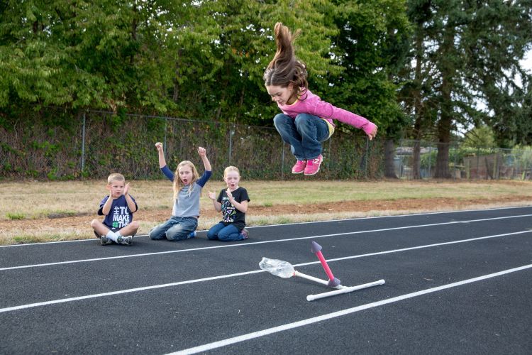 Girl jumping up high