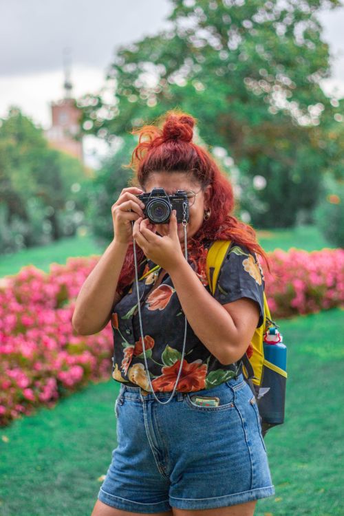 Girl taking a picture with a camera