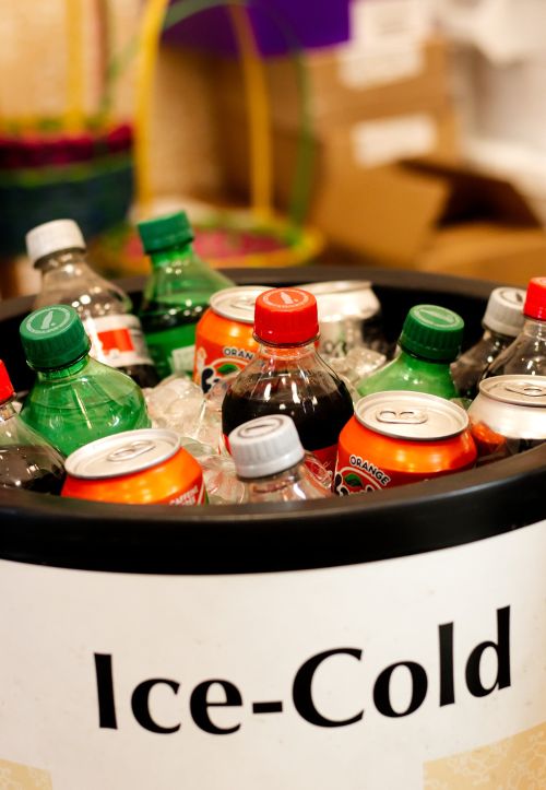 Various soft drinks in a cooler.