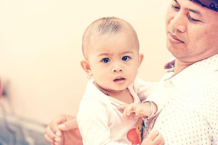 Man holding baby