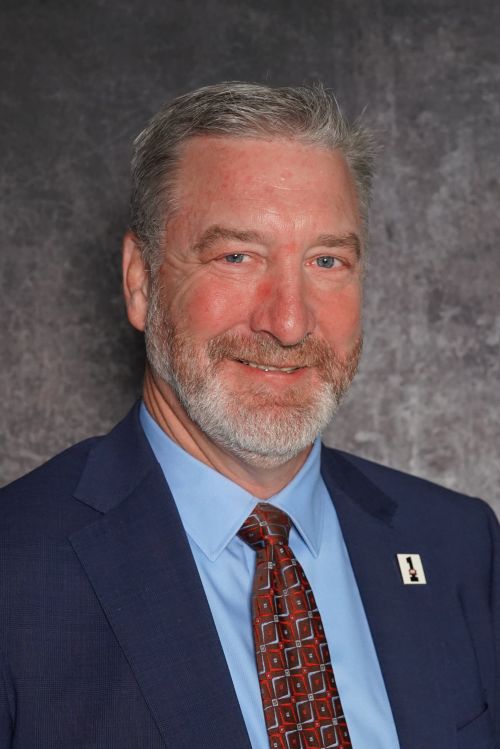Man with a dark blue suit.