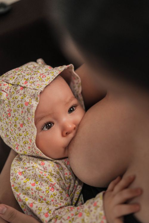 A baby breastfeeding.