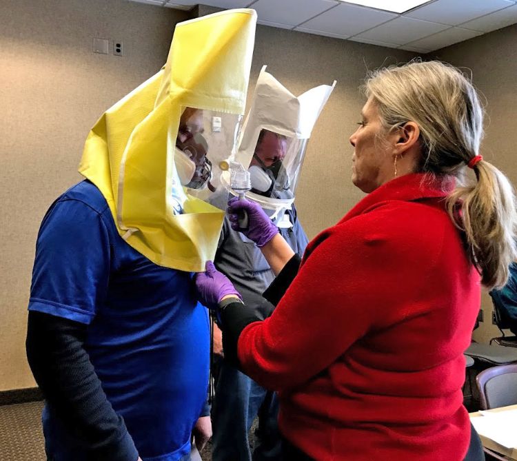 Growers undergoing their annual respirator fit testing at an MSU Extension meeting in January 2018. Photo by Heidi Lindberg, MSU Extension.