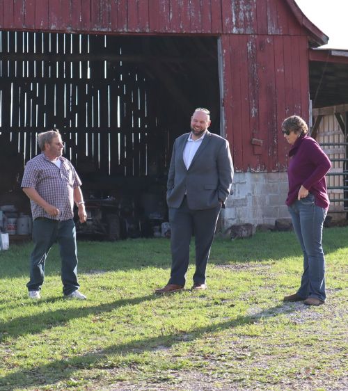 MSU Extension farm stress staff visit with farmers.