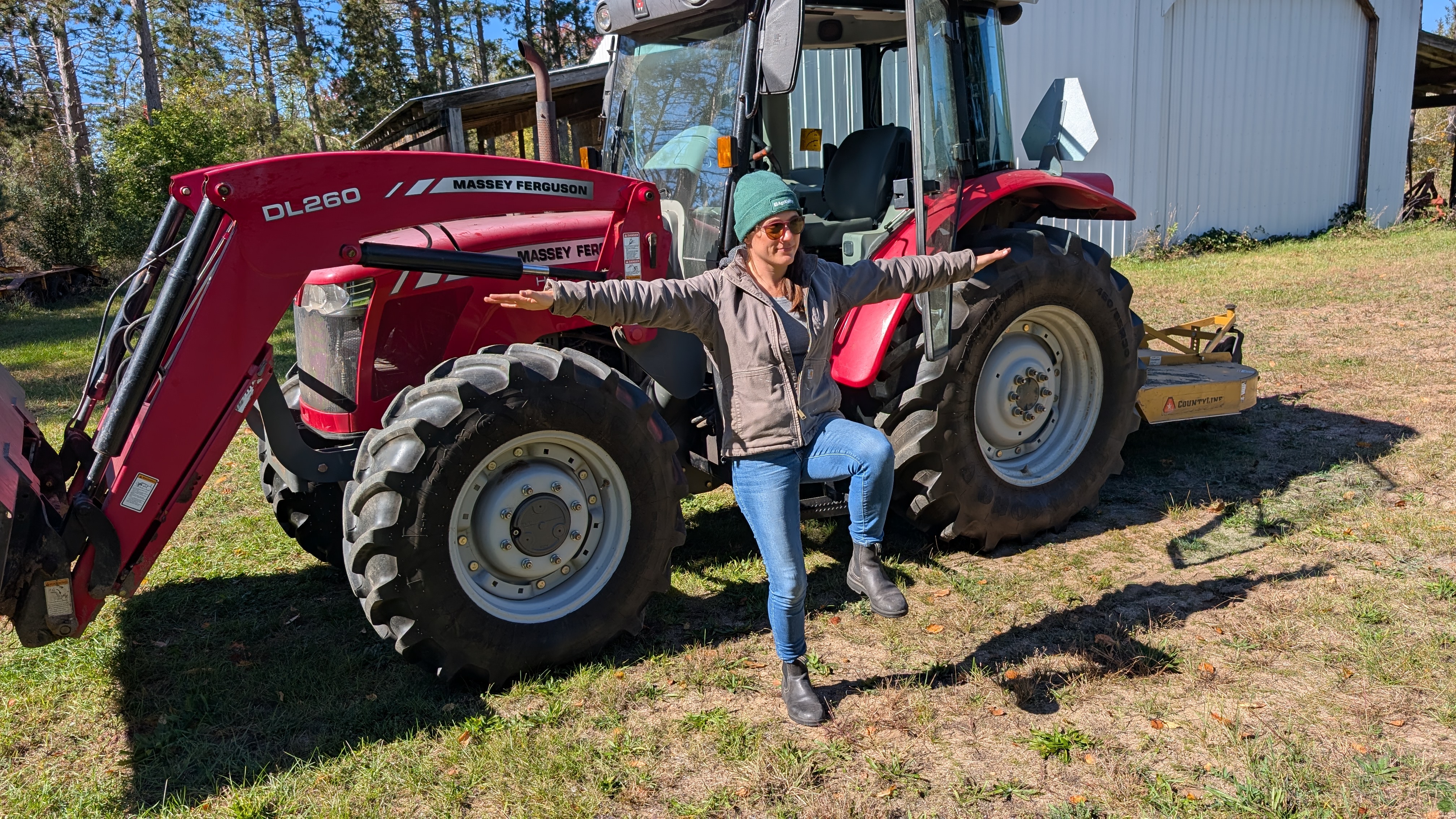 image of a farmer standing with one leg raised