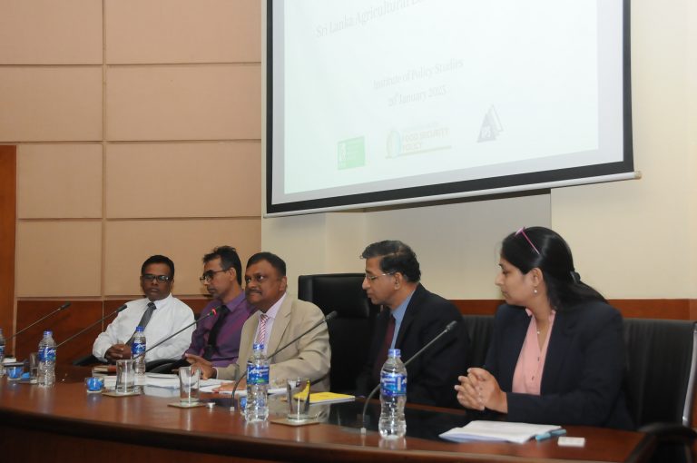 Suresh Babu at a table with other participants