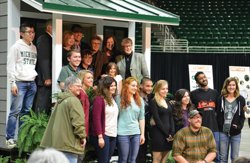 Group photo in front of Sparty's Cabin at the Ribbon Cutting Ceremony.