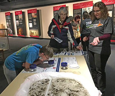 Participants learning about aquatic macro-invertebrate